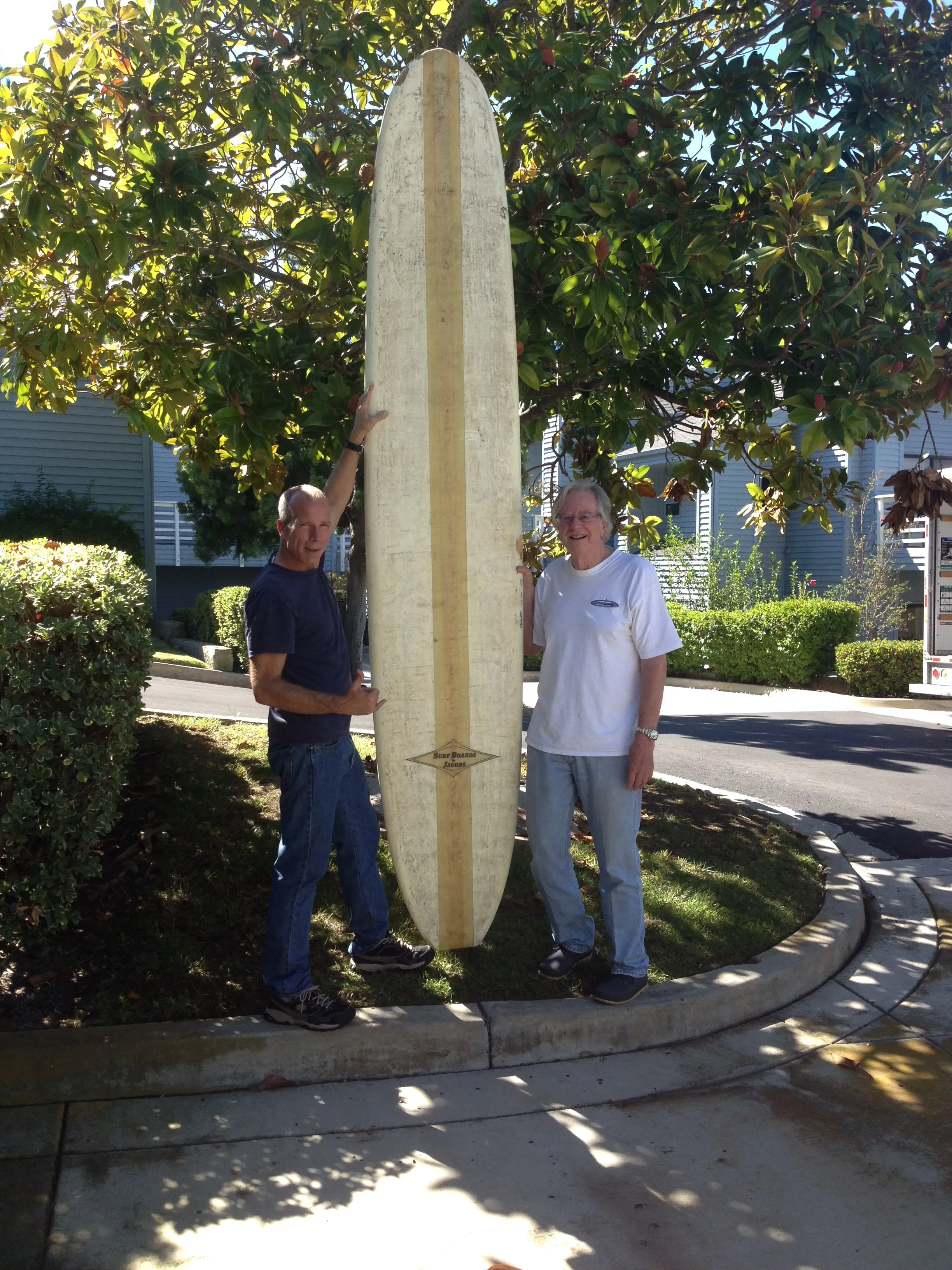 Dr. Ian Purcell with Moondoggie and a vintage Jacobs surfboard