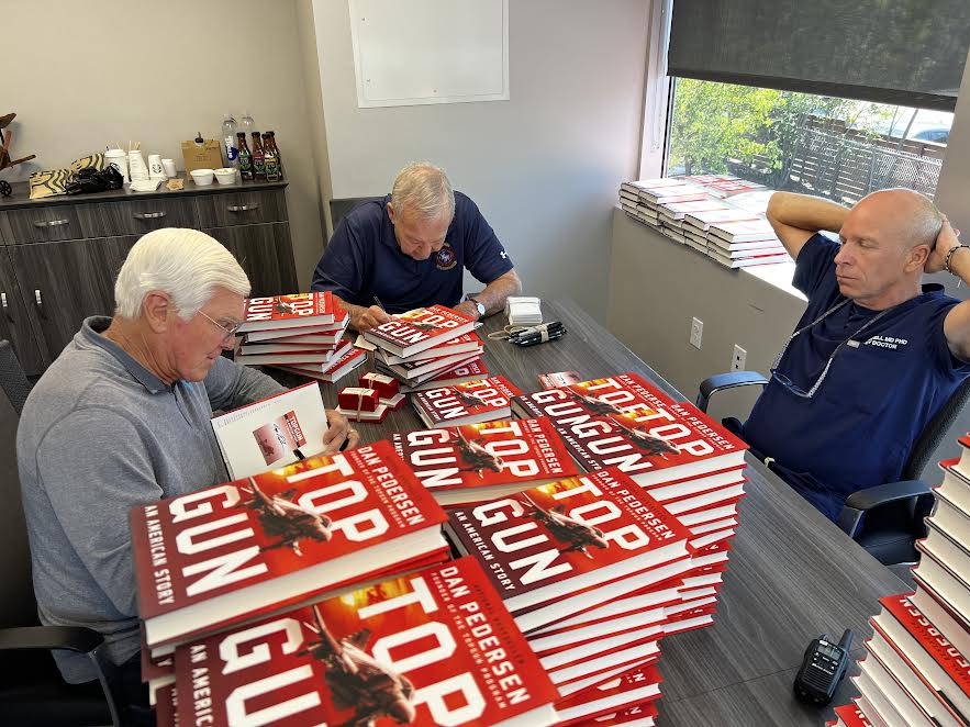 Dan Pedersen and guests signing Top Gun books with Dr. Ian Purcell