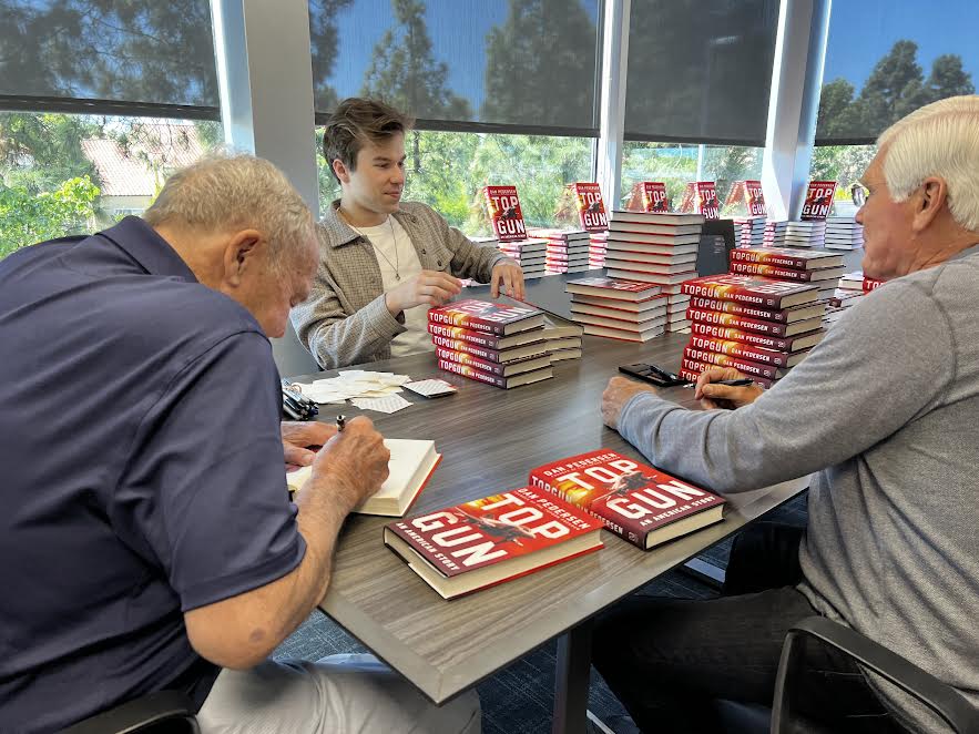Authors signing Top Gun books at the Liberty Station event